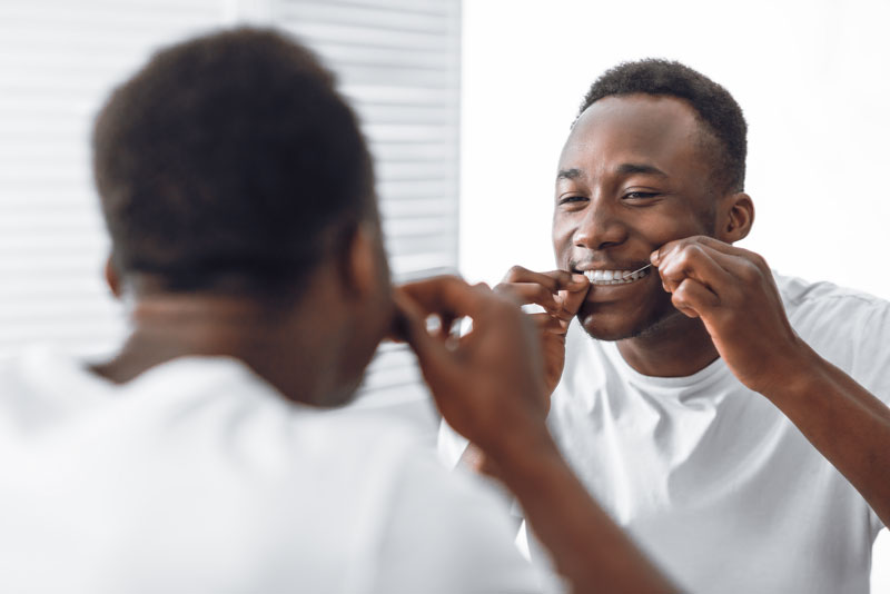 cosmetic dental patient looking in the mirror.