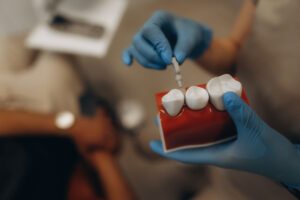 man smiling in a dental chair, patient in a dental office