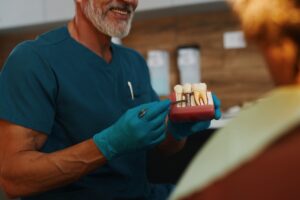 Dentist consulting with patient about front tooth treatment options in a modern office