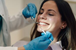 Dr. Noah Orenstein consulting with a patient in a modern dental office.